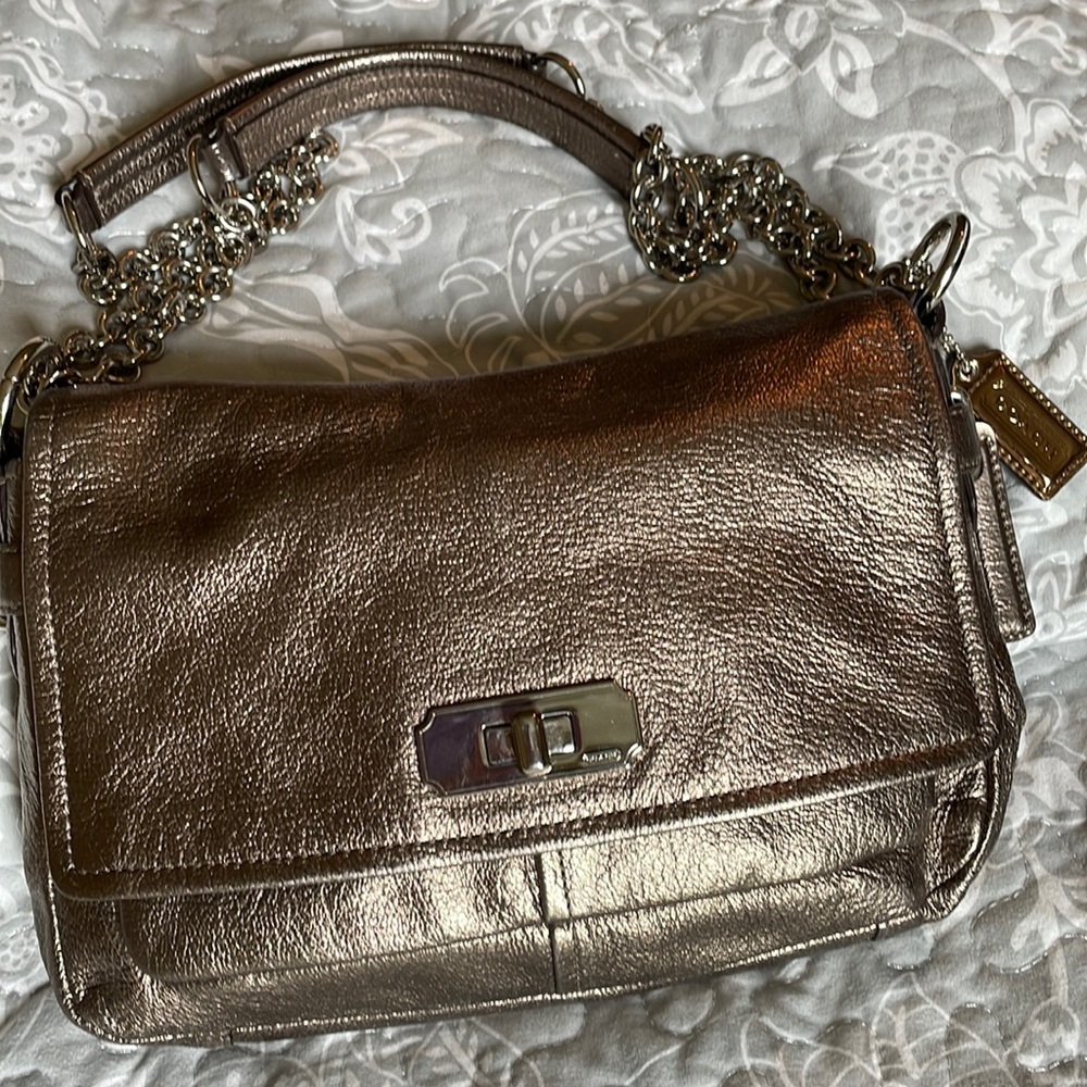 Gently used Coach soft leather handbag. Many pockets. Bronze shiny leather.